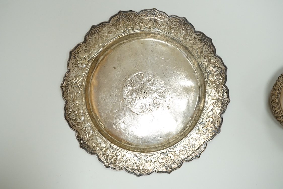 A Thai white metal tobacco box, embossed with foliage, diameter 72mm together with a similar dish.